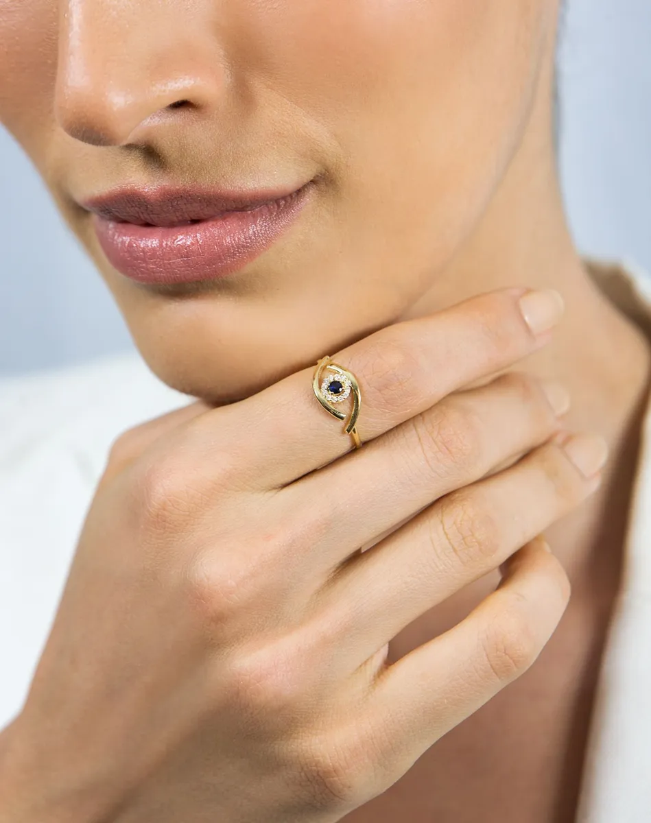 Anel de Ouro 18k olho grego vazado com Safira azul e Diamantes