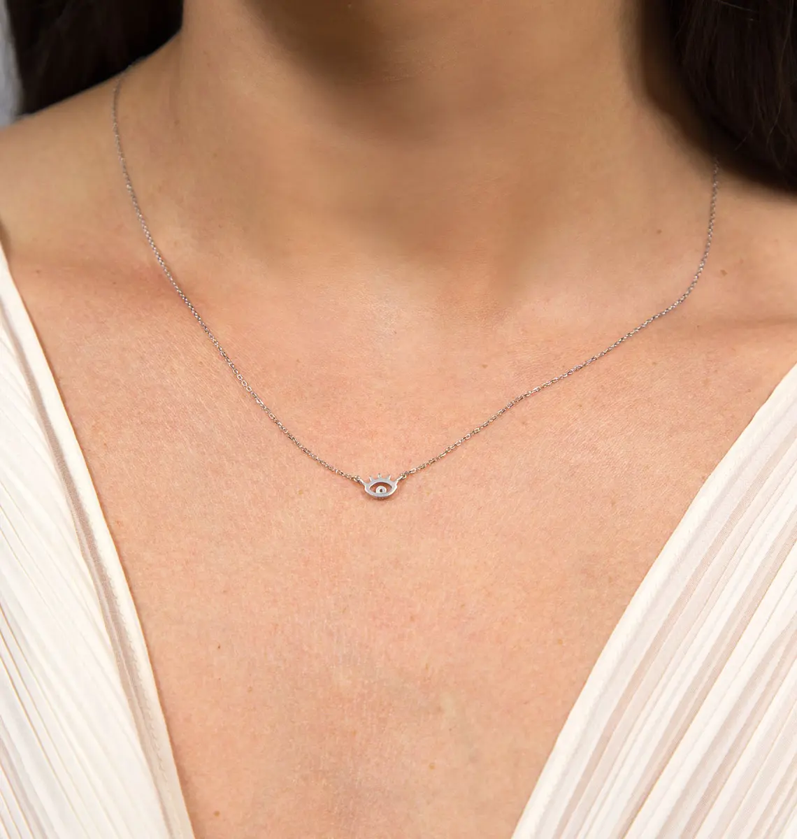 Gargantilha olho grego ouro branco 18k com um Diamante